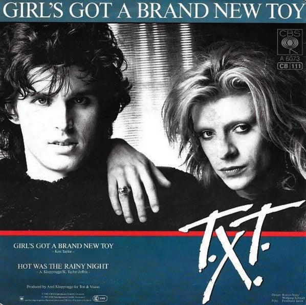 T.X.T. : Girl's Got A Brand New Toy (7",45 RPM,Single)