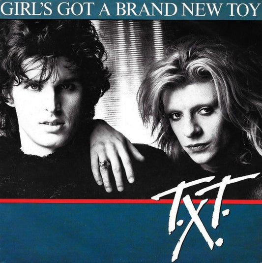 T.X.T. : Girl's Got A Brand New Toy (7",45 RPM,Single)