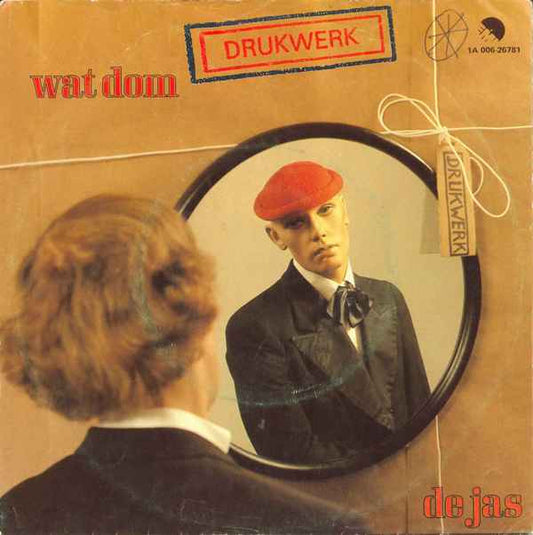 Drukwerk : Wat Dom / De Jas (7",45 RPM,Single)