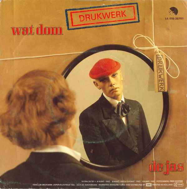 Drukwerk : Wat Dom / De Jas (7",45 RPM,Single)